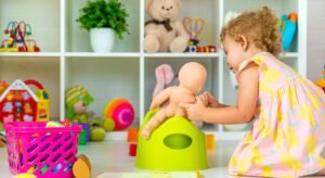 Children sit on the potty in the room. Selective focus.